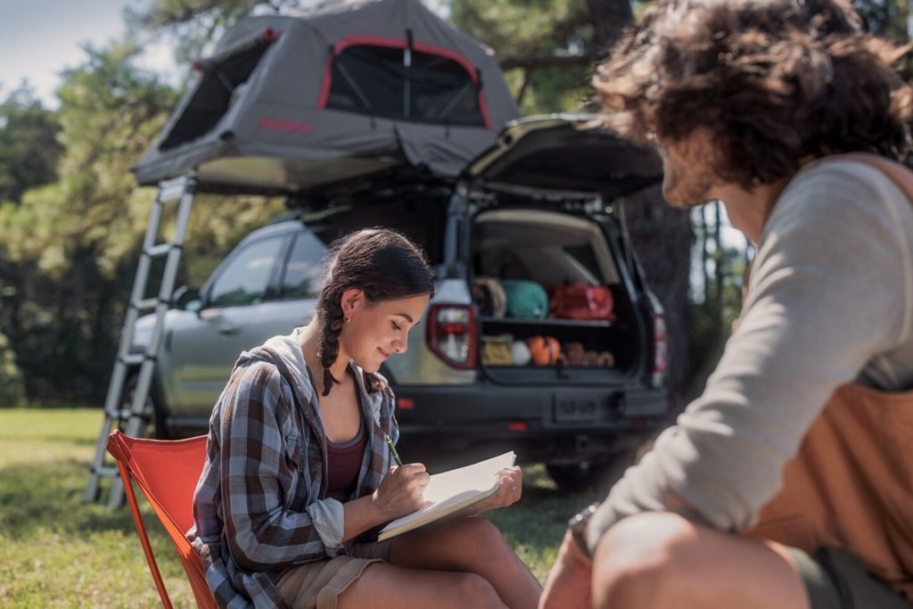 Young women camping with a Bronco Sport