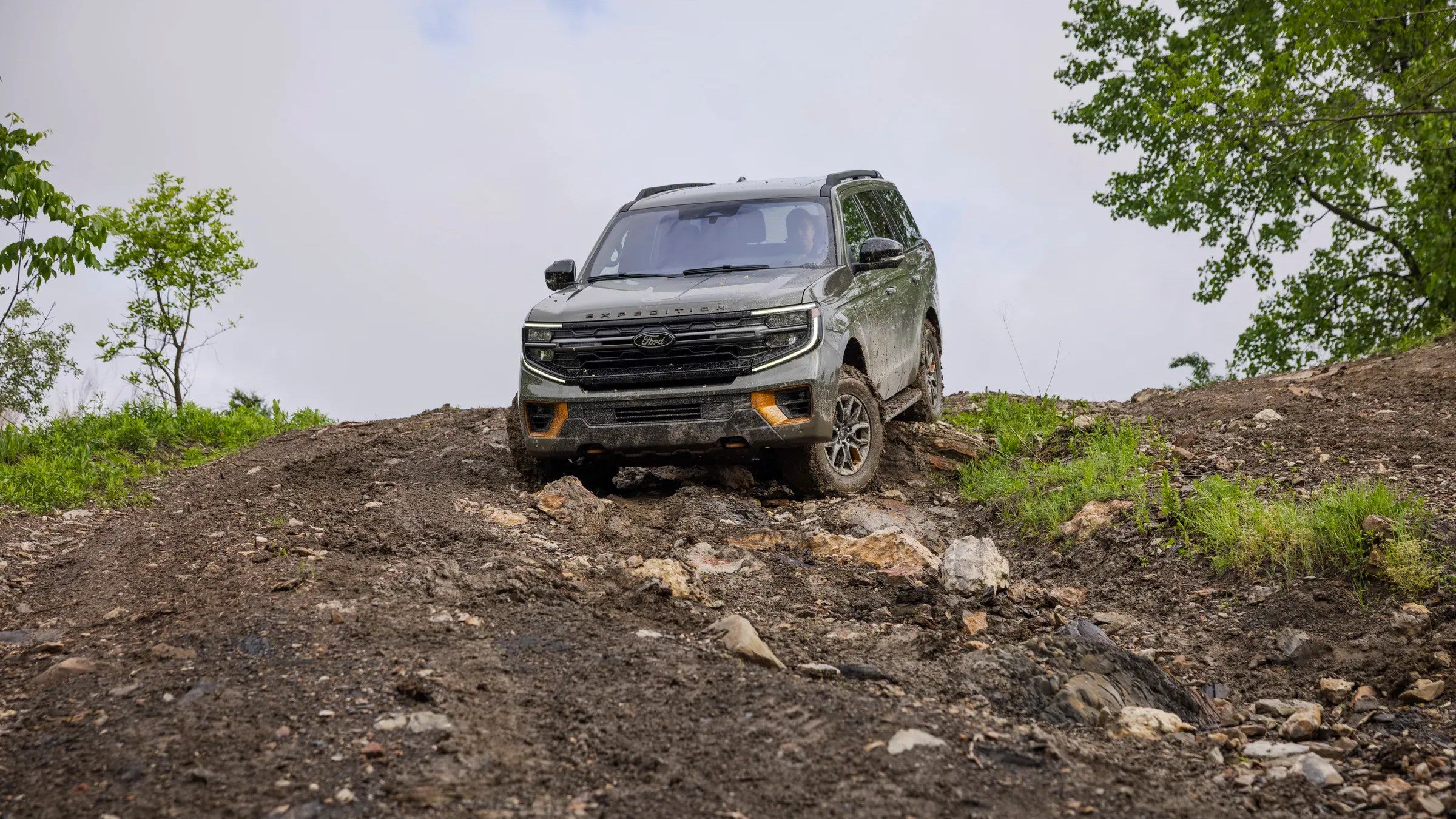 Ford Explorer climbing a rocky off-road trail